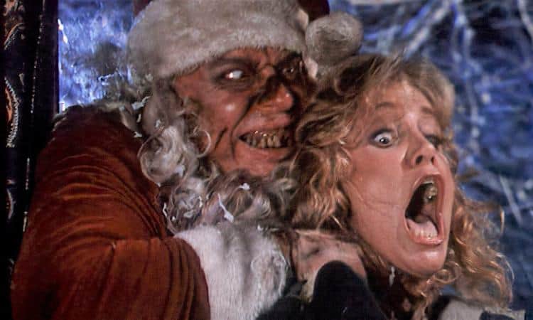 In this holiday horror short film, an evil-looking figure dressed as Santa Claus menacingly grips a terrified woman by the neck amid a snowy scene. Her expression of extreme fear underscores the unconventional twist on seasonal cheer.