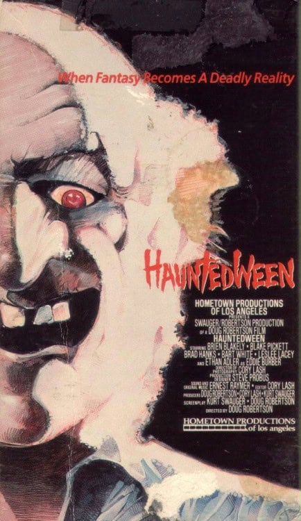 A creepy clown with a sinister grin is shown against a dark background. Above the clown, red text reads, "When Fantasy Becomes A Deadly Reality." Below, the movie title "HauntedWeen" appears in bold red letters.