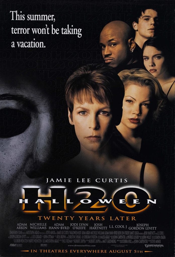Movie poster for the horror movie “Halloween H20: Twenty Years Later.” Features Jamie Lee Curtis and other cast members’ faces, a dark background, and an ominous shadow, with the tagline: “This summer, terror won’t be taking a vacation.” Perfect for Halloween season thrills.