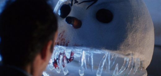 A man faces a large, menacing snowman with sharp icy teeth, dark eyes, and scars, resembling Jack Frost gone rogue. The snowman seems threatening yet absurdly fitting for a horror comedy set against a dark and eerie Christmas backdrop.